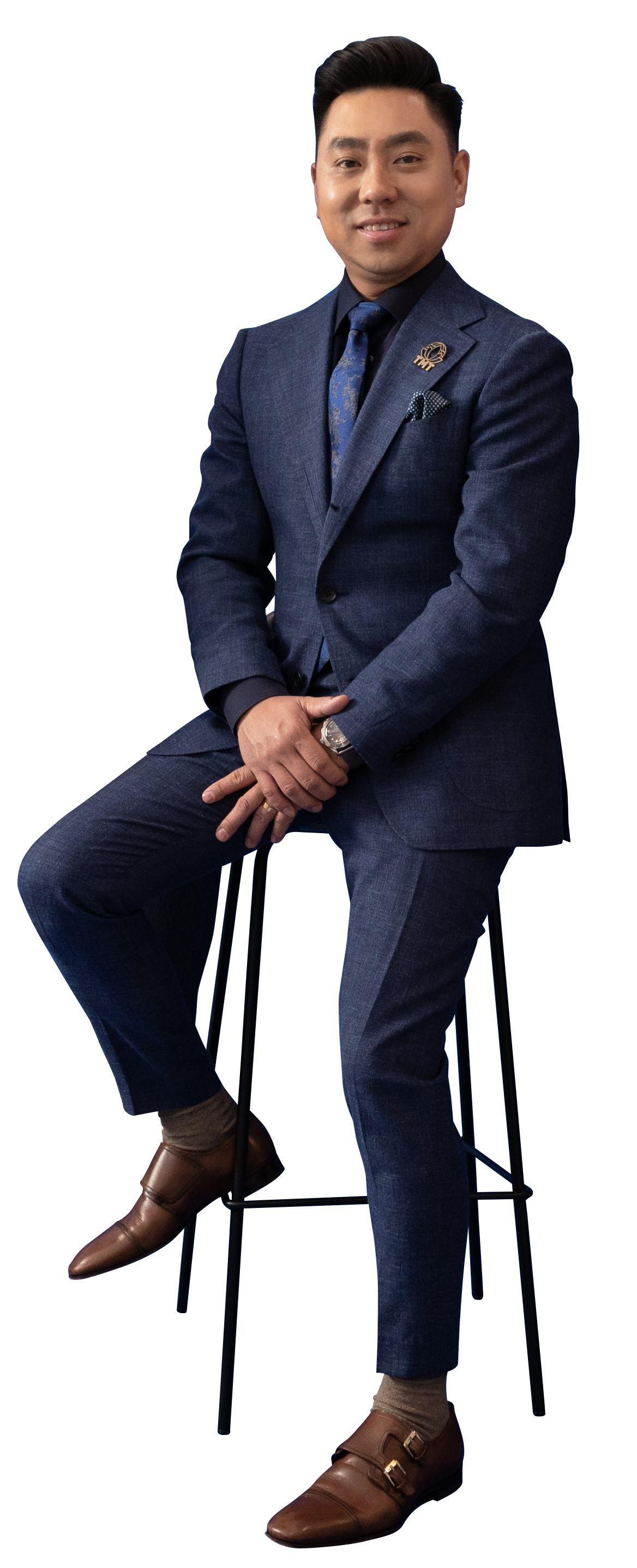 tony half sit in chair hands together